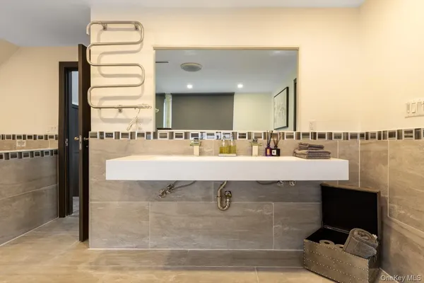 a large bathroom with a large tub and sink