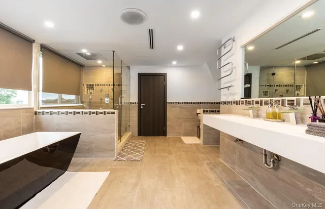 a bathroom with a bathtub and a shower