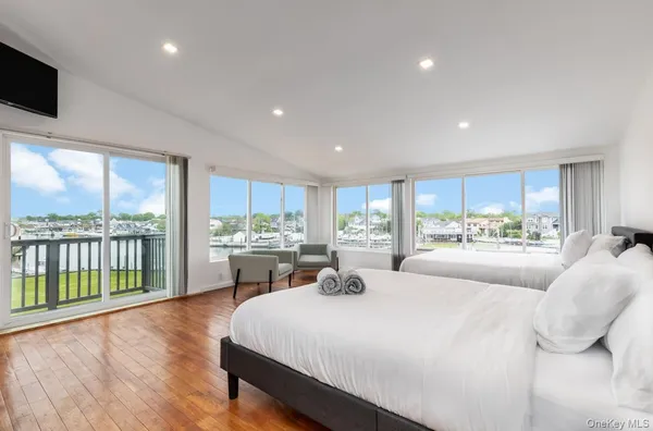a spacious bedroom with a bed and a couch