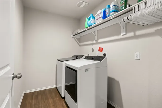 a bathroom with a granite countertop toilet and a shower