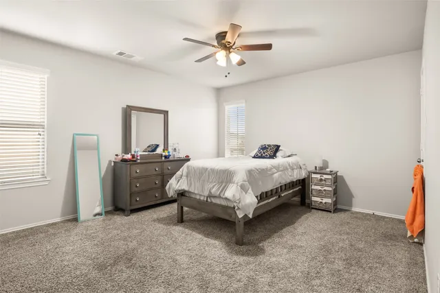 a view of dining room with furniture and a flat screen tv
