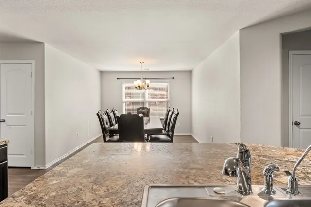 a view of a dining room with furniture and window