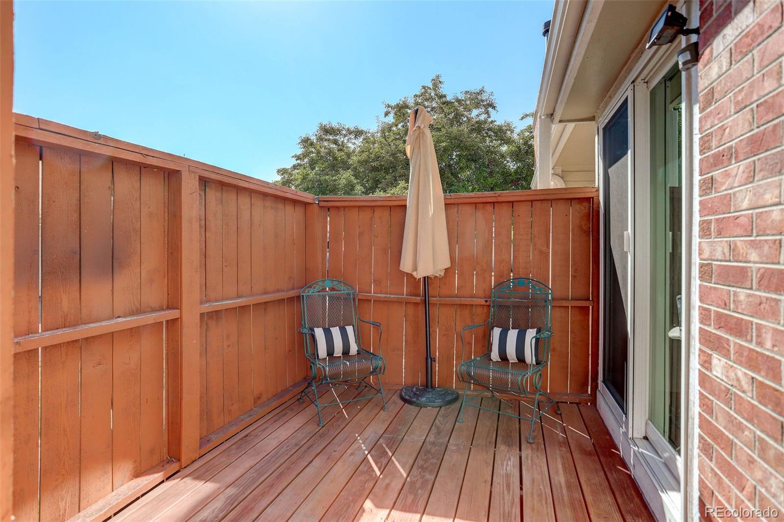 12132 Bannock Circle, Unit E Westminster, CO 80234 - Photo 2 of 26 a view of a balcony with wooden floor