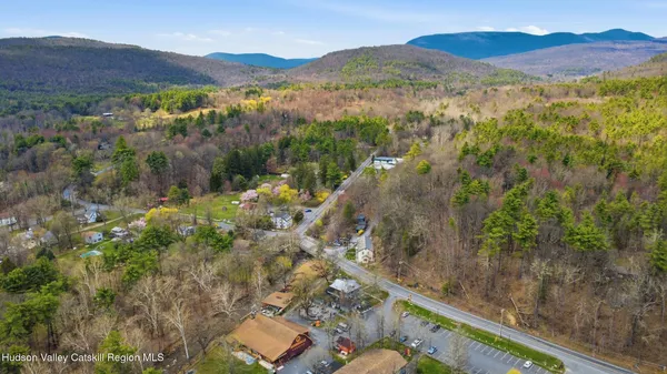 a view of a mountain with a yard