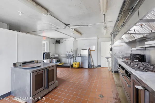 a kitchen that has a stove and a sink