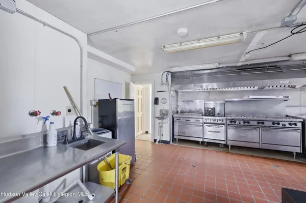 a kitchen with counter top space cabinets and stainless steel appliances