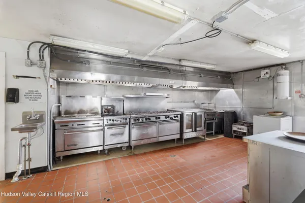 a kitchen with stainless steel appliances granite countertop a sink and cabinets