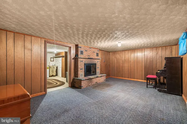 a view of a hall with wooden floor