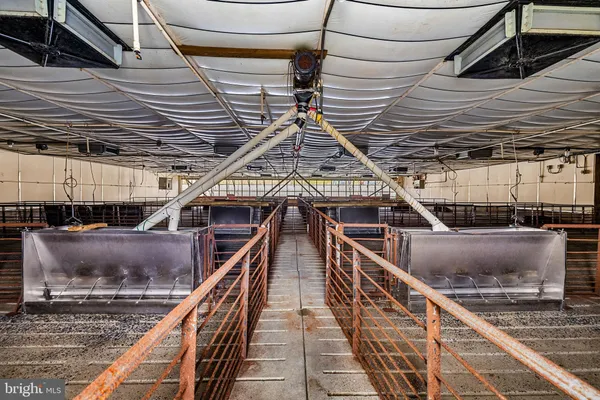 a view of a water heater room with a garage