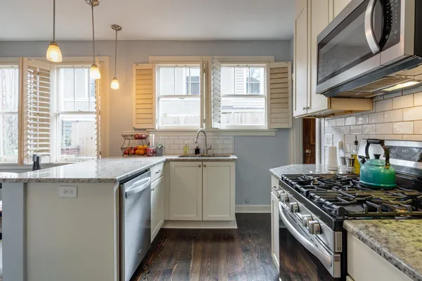 a view of a livingroom with workspace and a window