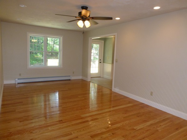 Lot 1 Baker Hill Road Spencer, MA 01562 - Photo 12 of 28 an empty room with wooden floor and windows