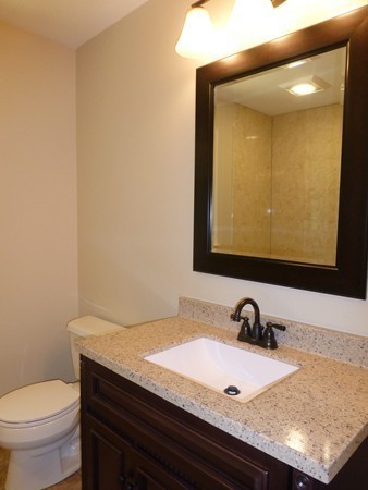 Lot 1 Baker Hill Road Spencer, MA 01562 - Photo 20 of 28 a bathroom with a granite countertop sink and a toilet