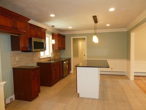 Lot 1 Baker Hill Road Spencer, MA 01562 - Photo 8 of 28 a large kitchen with stainless steel appliances kitchen island granite countertop a sink counter space and cabinets