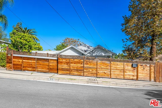 a view of a house with a street