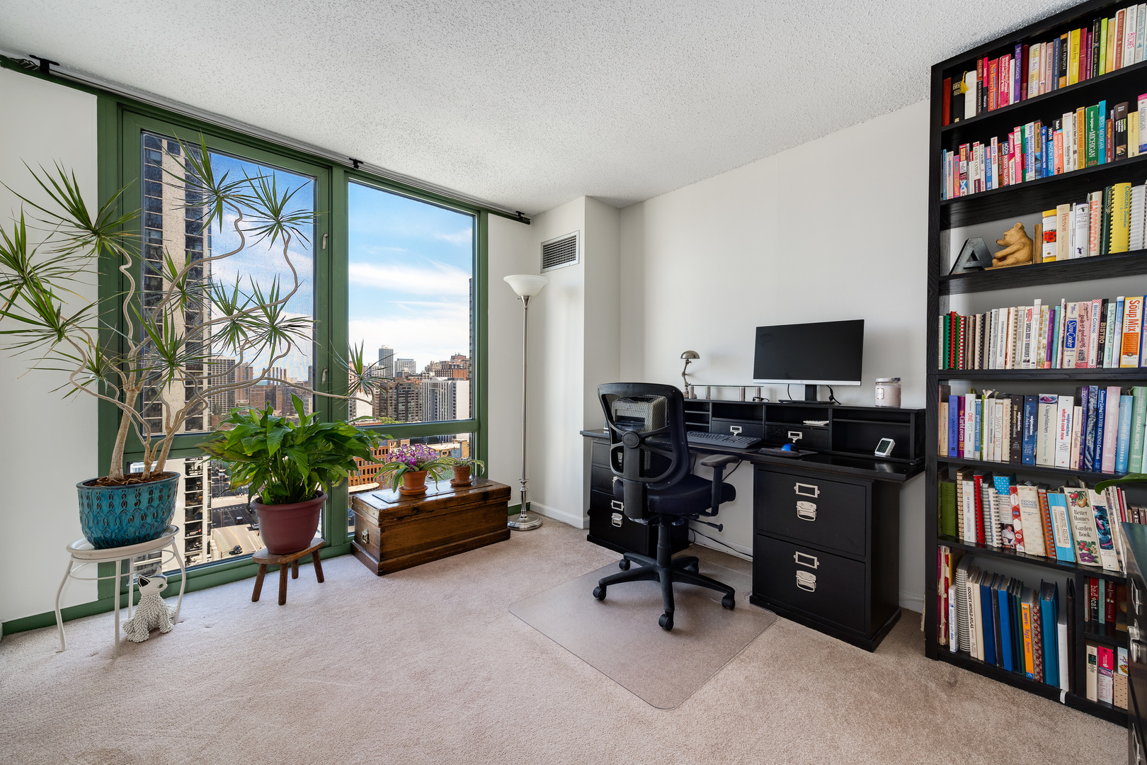 111 West Maple Street, Unit 1601 Chicago, IL 60610 - Photo 15 of 24 a view of a livingroom with workspace and a window
