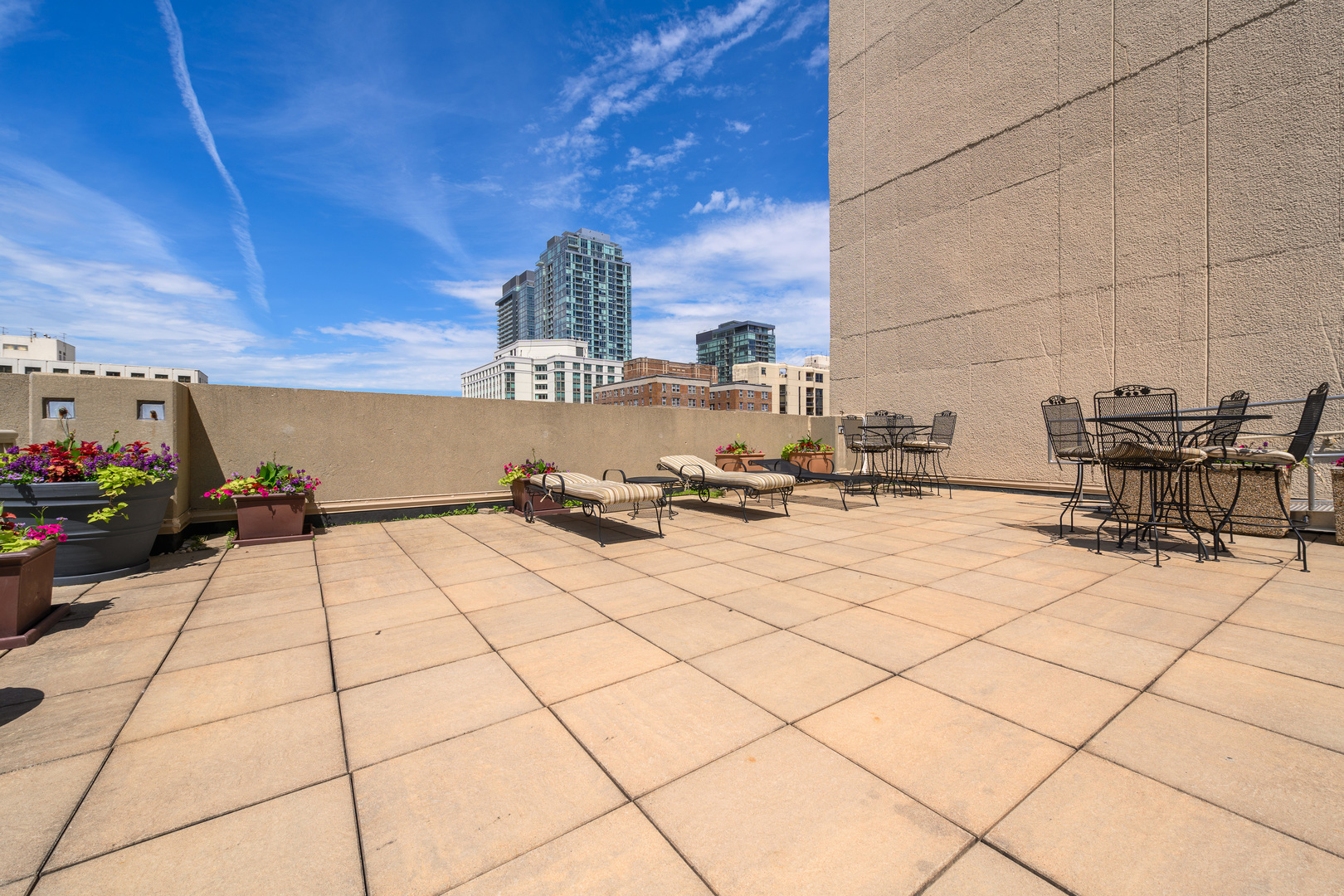 111 West Maple Street, Unit 1601 Chicago, IL 60610 - Photo 23 of 24 a view of open kitchen with dining table and chairs