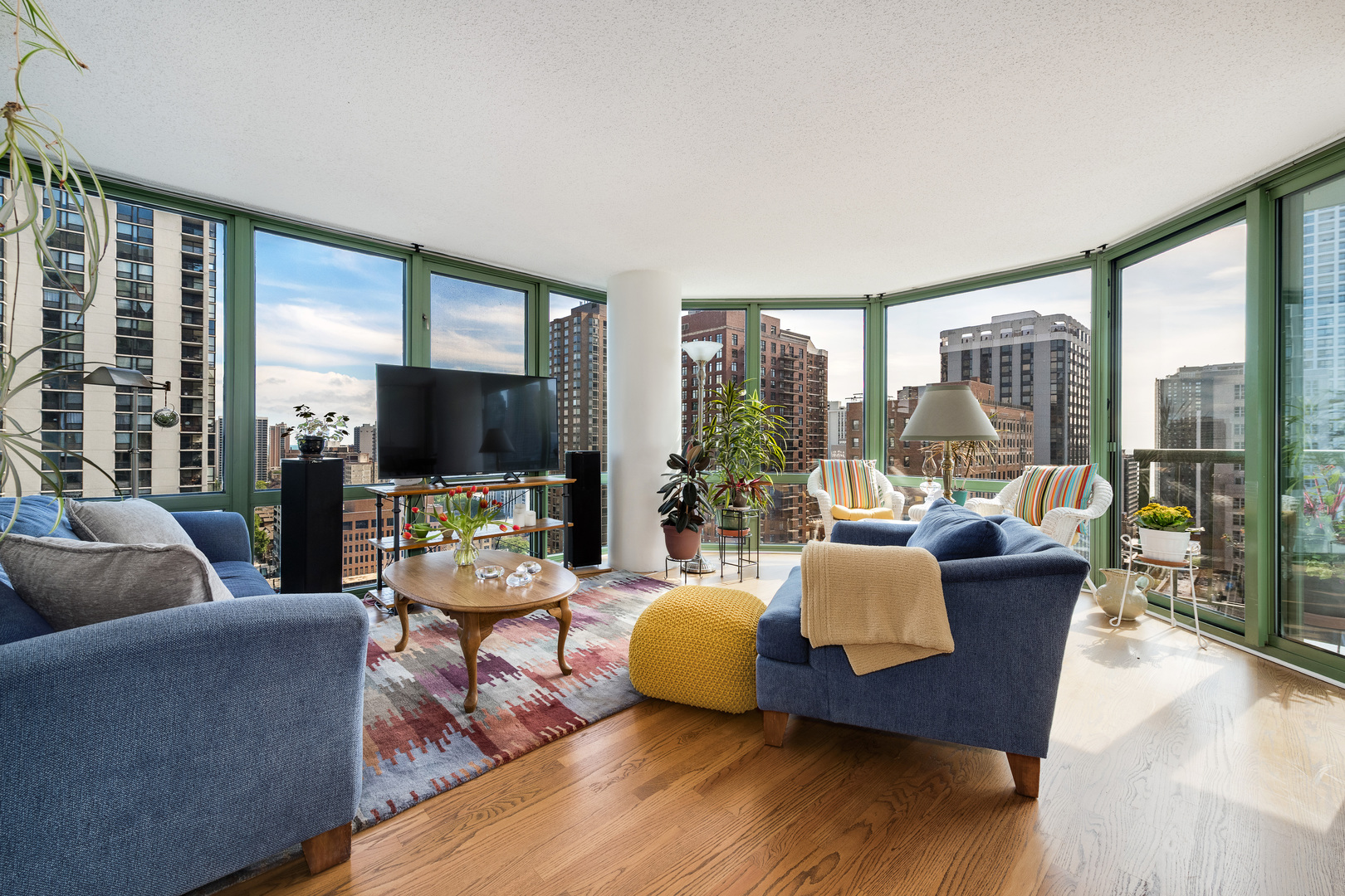 111 West Maple Street, Unit 1601 Chicago, IL 60610 - Photo 3 of 24 a living room with furniture and a flat screen tv