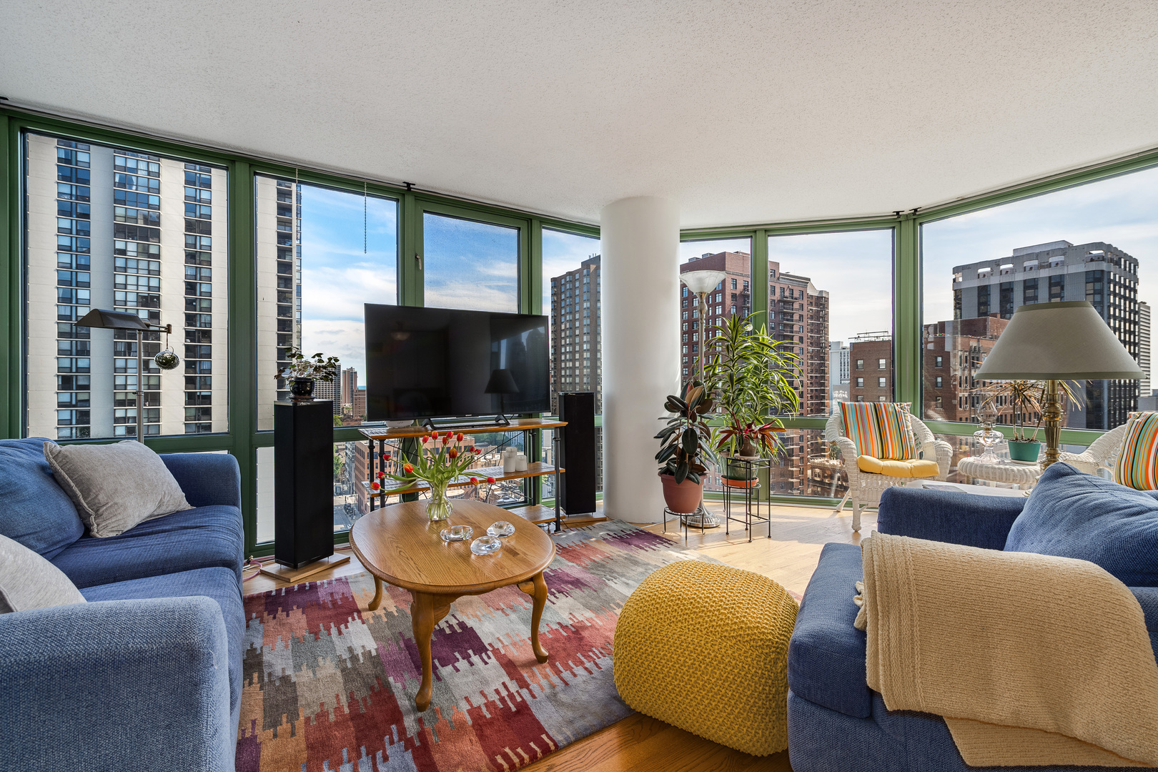 111 West Maple Street, Unit 1601 Chicago, IL 60610 - Photo 4 of 24 a living room with furniture and a flat screen tv