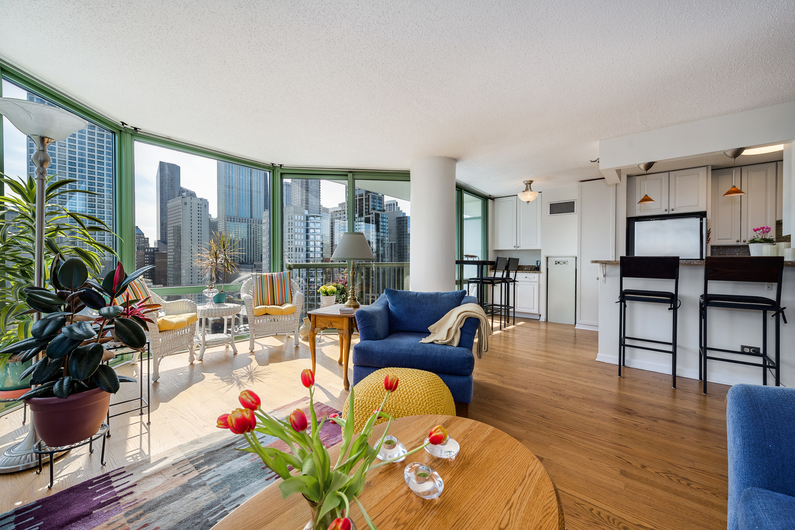 111 West Maple Street, Unit 1601 Chicago, IL 60610 - Photo 7 of 24 a living room with furniture and wooden floor