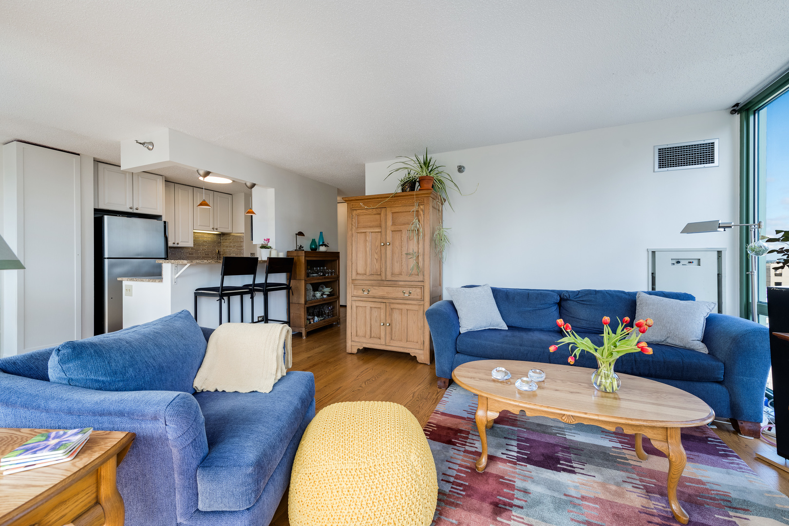 111 West Maple Street, Unit 1601 Chicago, IL 60610 - Photo 8 of 24 a living room with furniture and wooden floor
