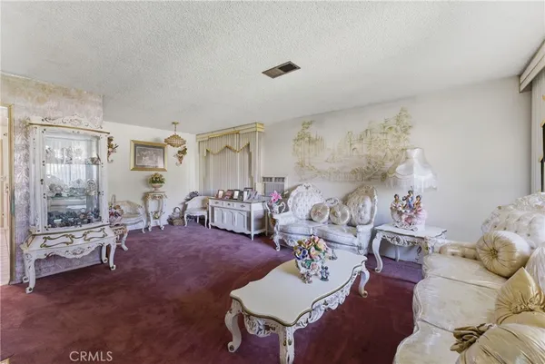 a living room with furniture and a table