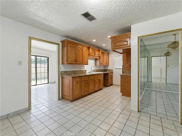 a kitchen with stainless steel appliances cabinets a sink and a counter top space