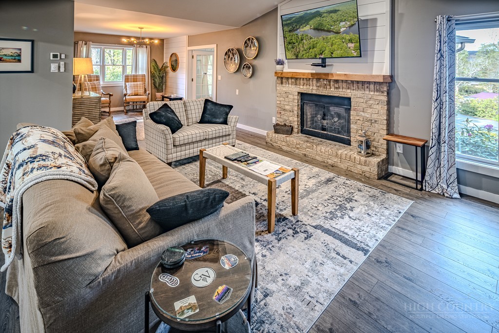 88 Trillium Road Newland, NC 28657 - Photo 16 of 44 a living room with furniture and a fireplace