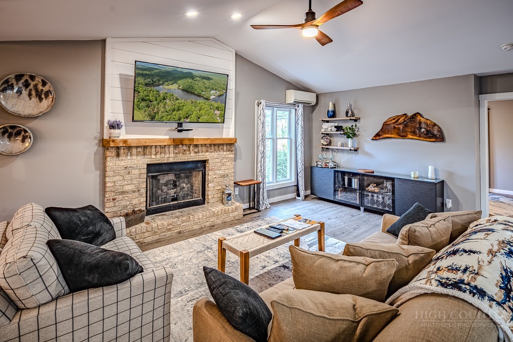 88 Trillium Road Newland, NC 28657 - Photo 18 of 44 a living room with furniture and a fireplace