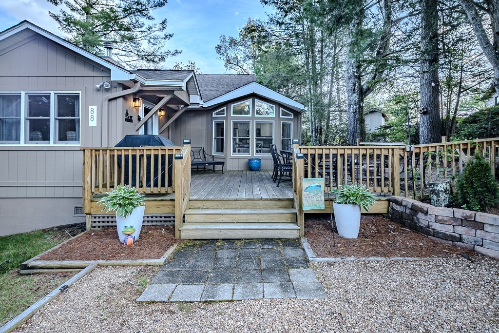 88 Trillium Road Newland, NC 28657 - Photo 2 of 44 a view of a house with sitting area and wooden fence