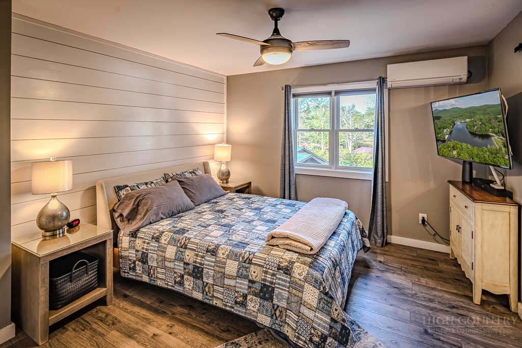 88 Trillium Road Newland, NC 28657 - Photo 29 of 44 a bedroom with a bed and a flat tv screen on dresser
