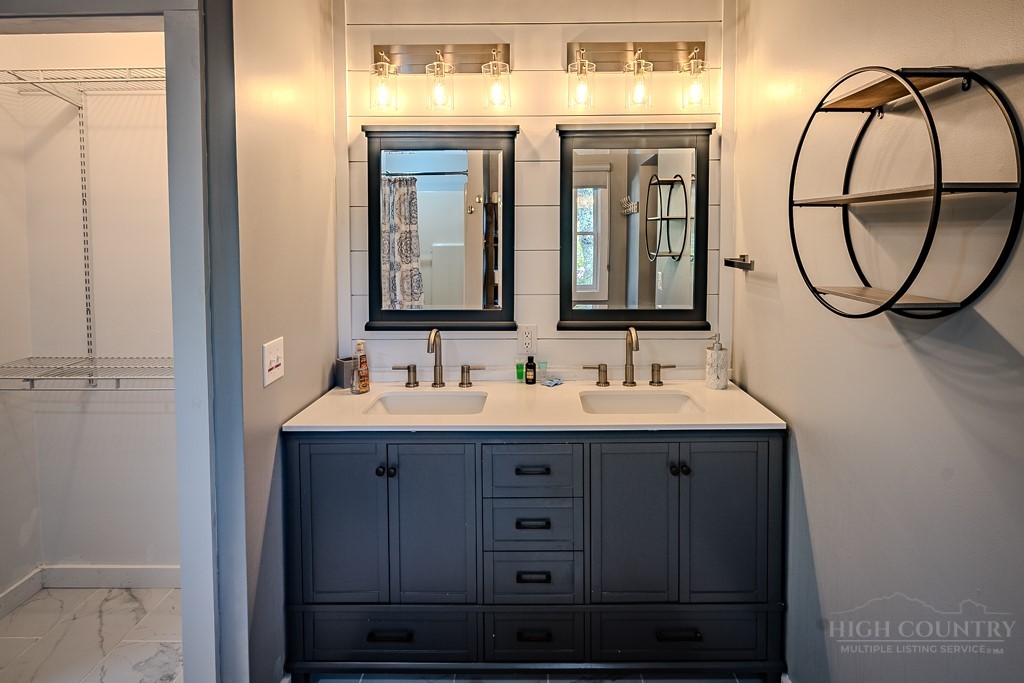 88 Trillium Road Newland, NC 28657 - Photo 32 of 44 a bathroom with a sink and a mirror