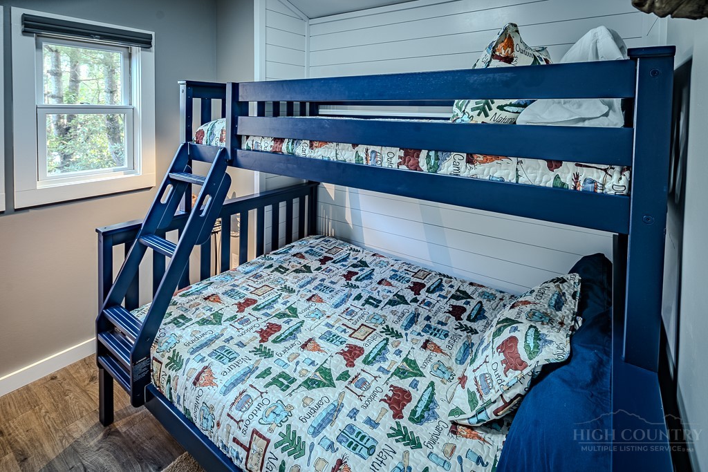 88 Trillium Road Newland, NC 28657 - Photo 35 of 44 a bed sitting in a bedroom next to a window