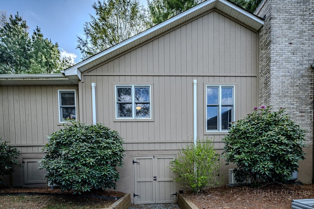 88 Trillium Road Newland, NC 28657 - Photo 41 of 44 a front view of a house with plants