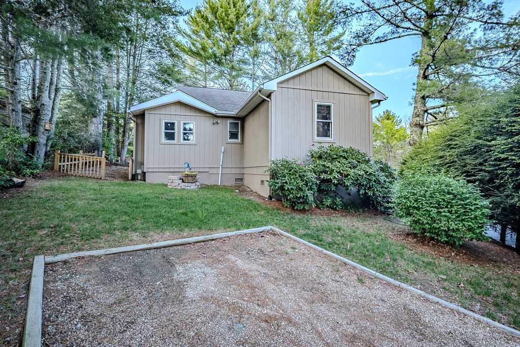 88 Trillium Road Newland, NC 28657 - Photo 44 of 44 a front view of a house with a yard and garage