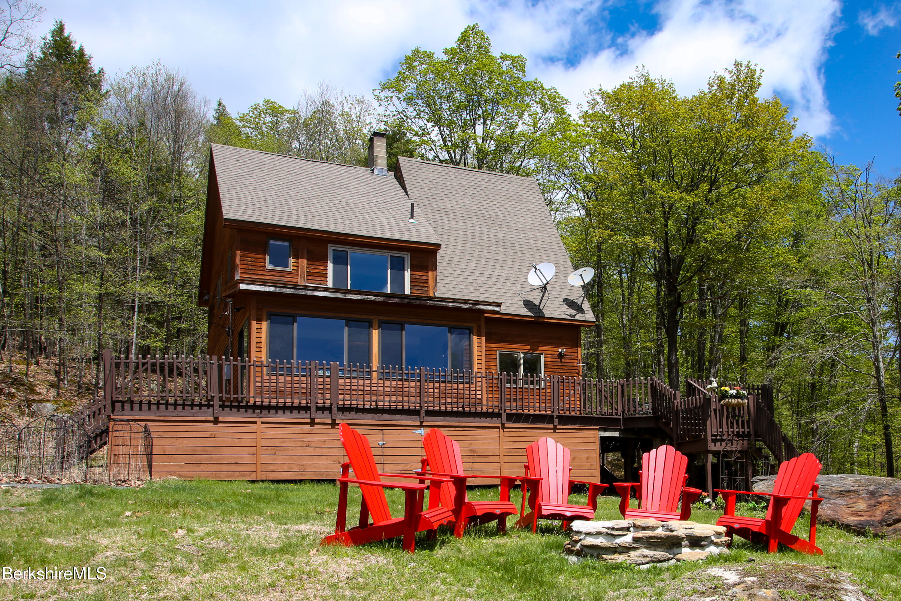 421 Legate Hill Road Charlemont, MA 01339 - Photo 32 of 37 a backyard of a house with barbeque oven and outdoor seating