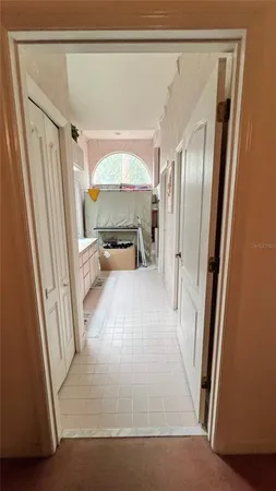a room with a bed and a dresser