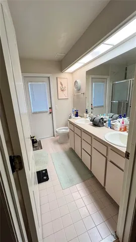 a living room with furniture and a mirror