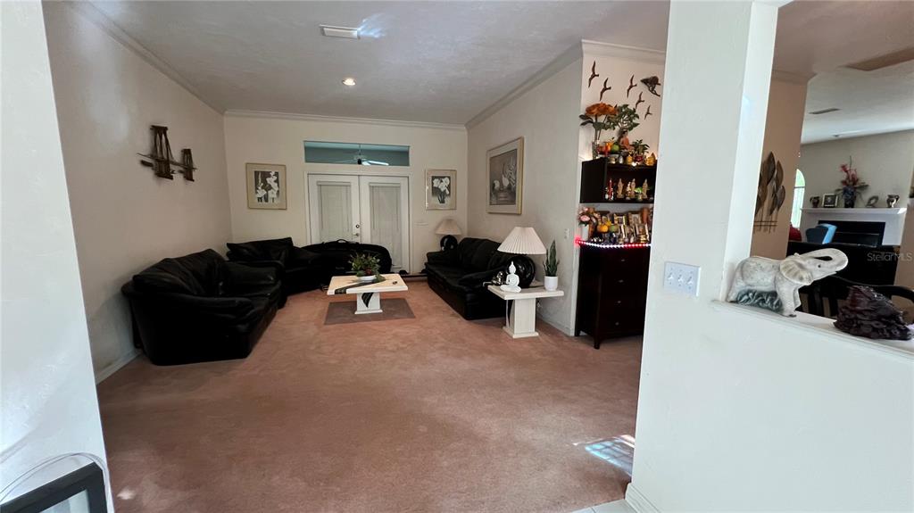 4305 Northwest 55 Way Gainesville, FL 32606 - Photo 7 of 14 a living room with furniture and a window