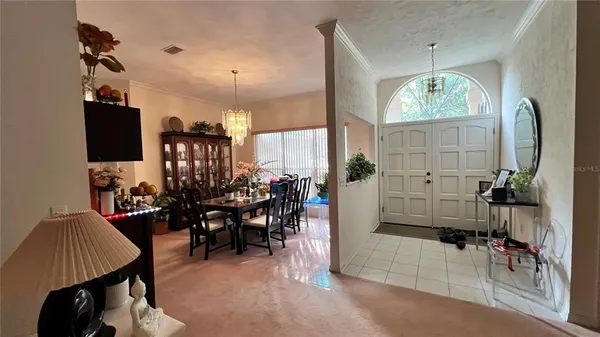 a view of a dining room with furniture window and outside view