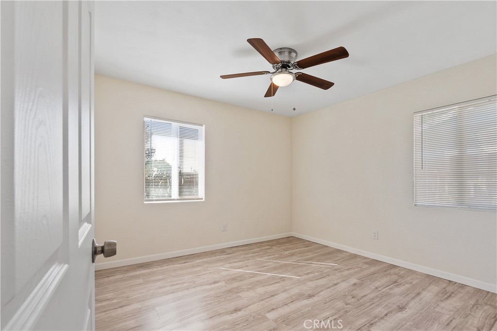 224 South Alessandro Street Hemet, CA 92543 - Photo 15 of 32 a view of empty room with wooden floor and window