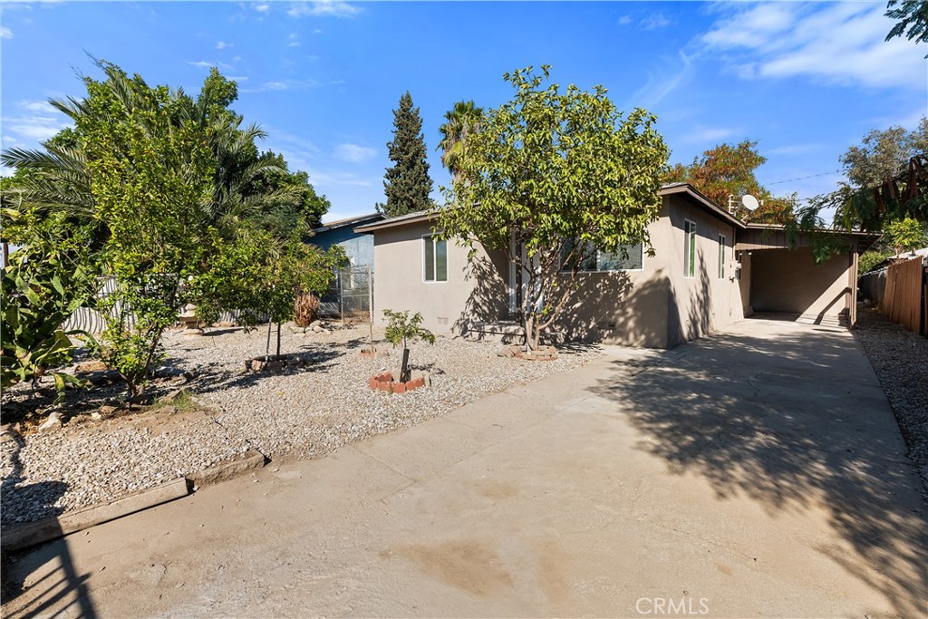 224 South Alessandro Street Hemet, CA 92543 - Photo 6 of 32 a view of a house with a tree and a yard