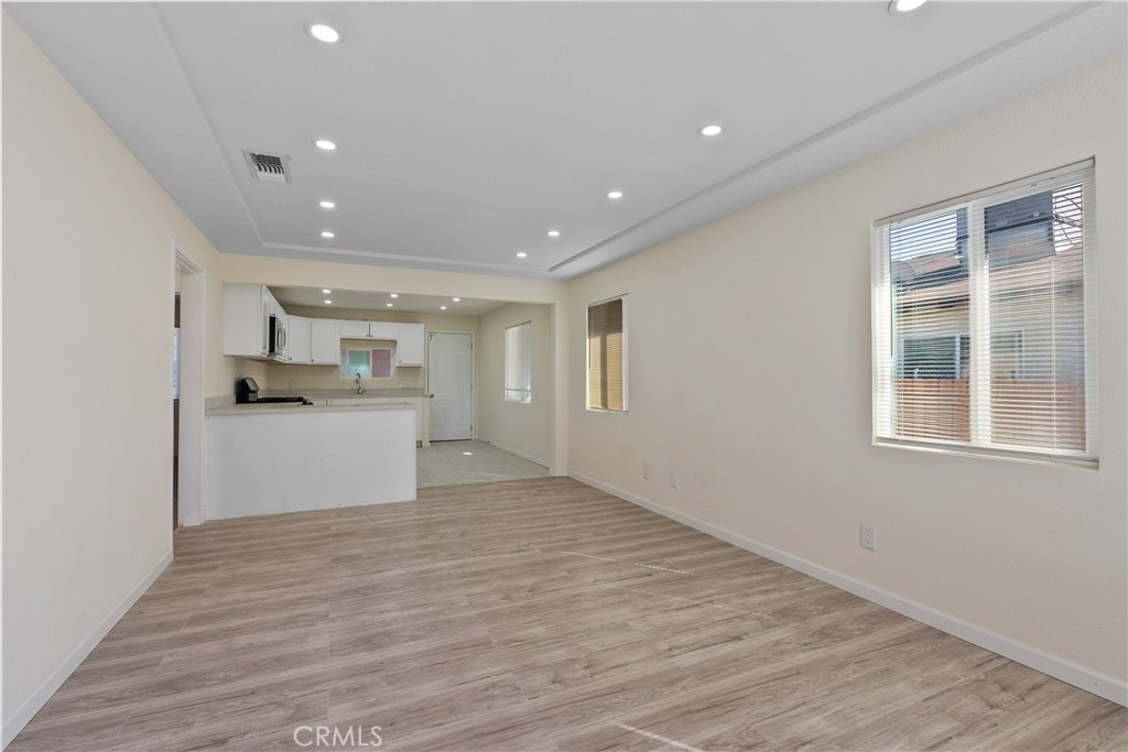 224 South Alessandro Street Hemet, CA 92543 - Photo 8 of 32 a view of a kitchen with wooden floor