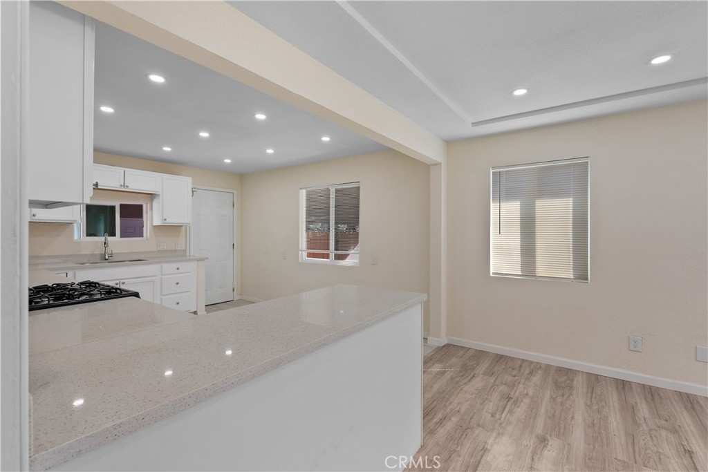 224 South Alessandro Street Hemet, CA 92543 - Photo 9 of 32 a view of a kitchen with a sink and microwave
