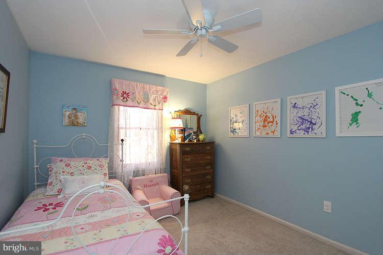 11525 Pine Cone Court Reston, VA 20191 - Photo 22 of 30 a bedroom with a bed and a window
