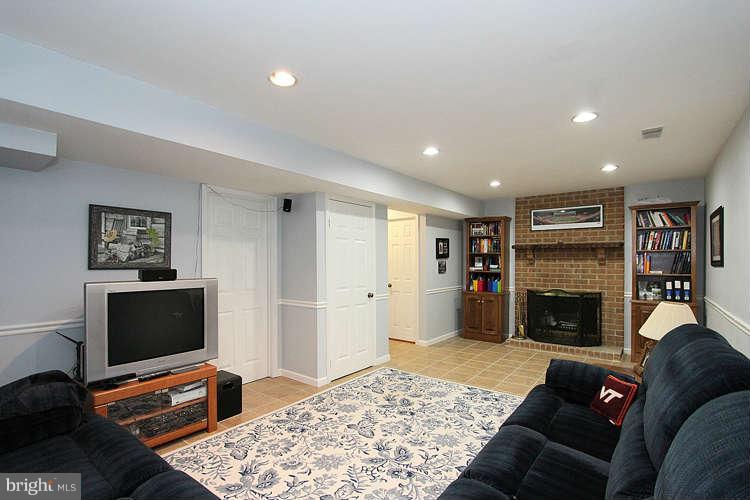 11525 Pine Cone Court Reston, VA 20191 - Photo 24 of 30 a living room with furniture and a fireplace