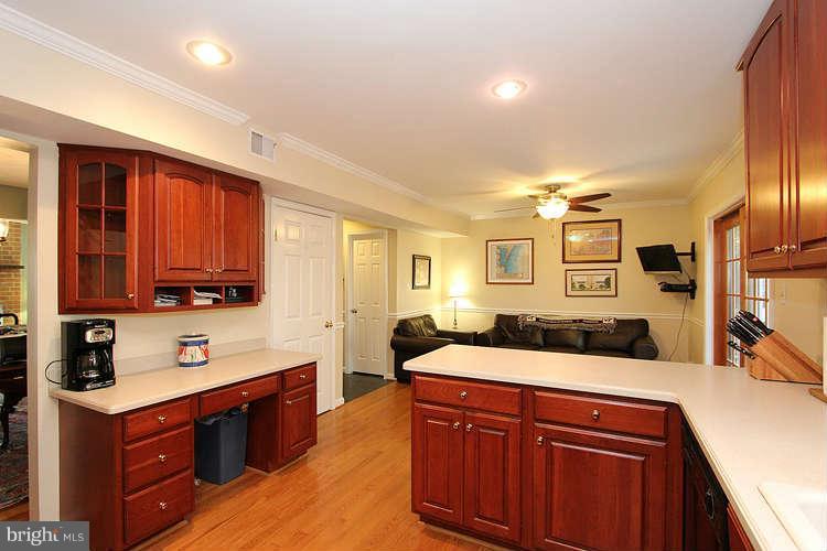 11525 Pine Cone Court Reston, VA 20191 - Photo 8 of 30 a kitchen with stainless steel appliances kitchen island granite countertop a sink stove and cabinets