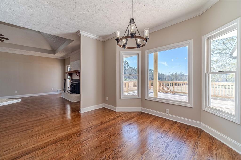 710 Youth Jersey Road Monroe, GA 30655 - Photo 14 of 53 a view of an empty room with wooden floor and a window