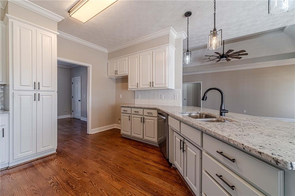 710 Youth Jersey Road Monroe, GA 30655 - Photo 15 of 53 a kitchen with a sink cabinets and wooden floor