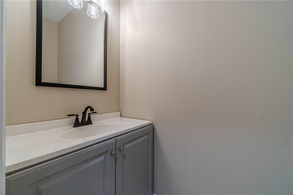 710 Youth Jersey Road Monroe, GA 30655 - Photo 24 of 53 a bathroom with a sink and a mirror