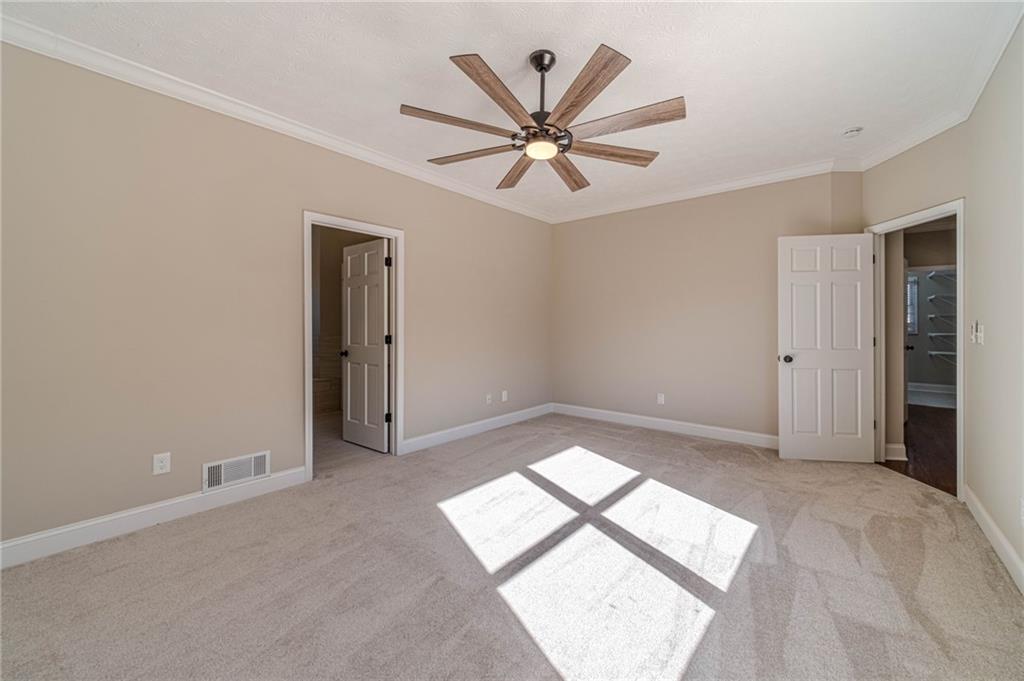 710 Youth Jersey Road Monroe, GA 30655 - Photo 26 of 53 an empty room with windows and fan